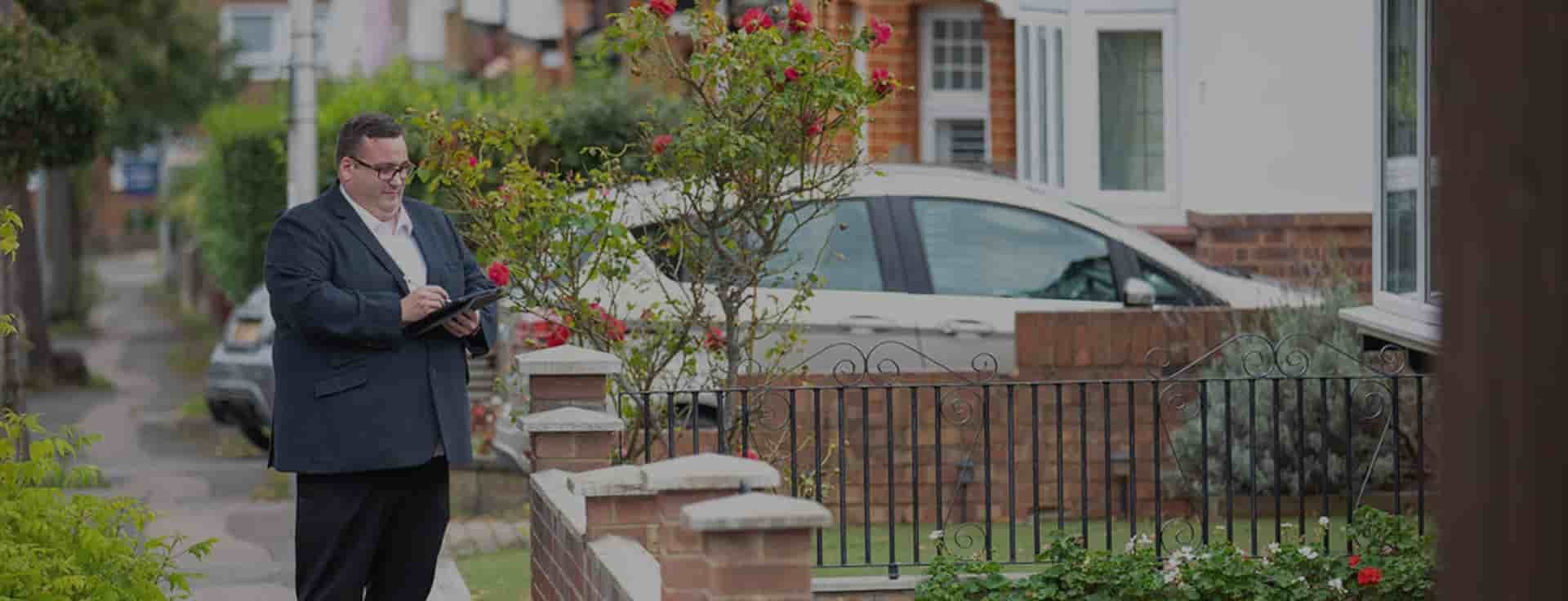 man surveying a property