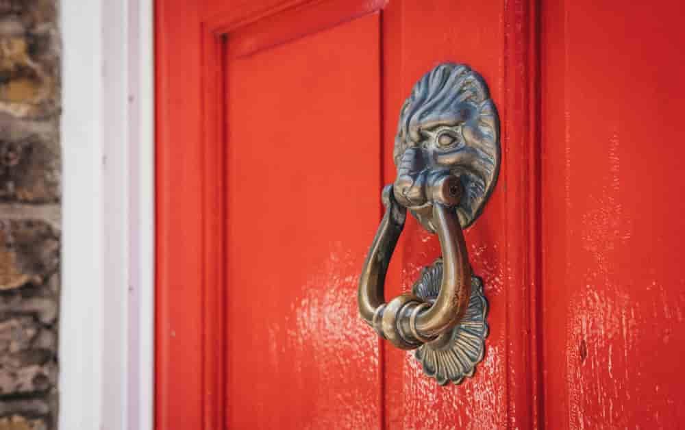 red door with knocker