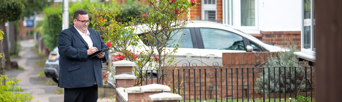 man surveying a property