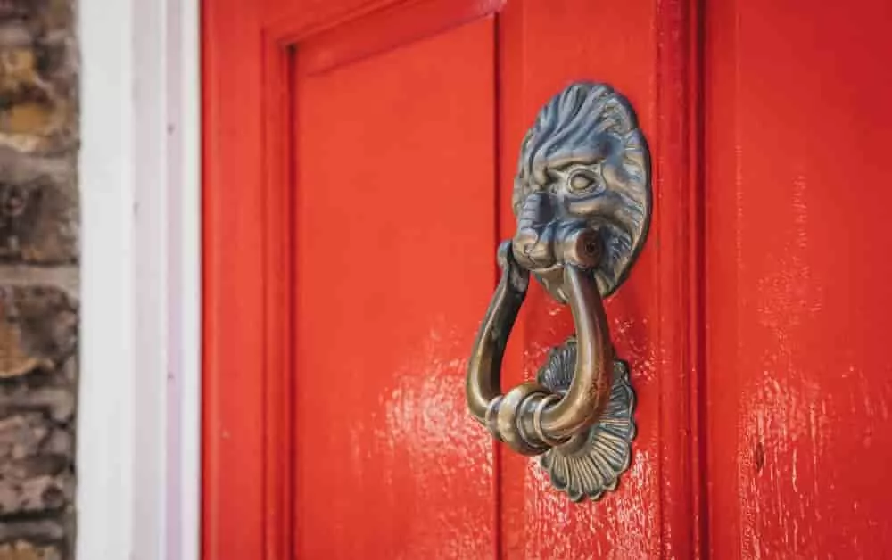 red door with knocker