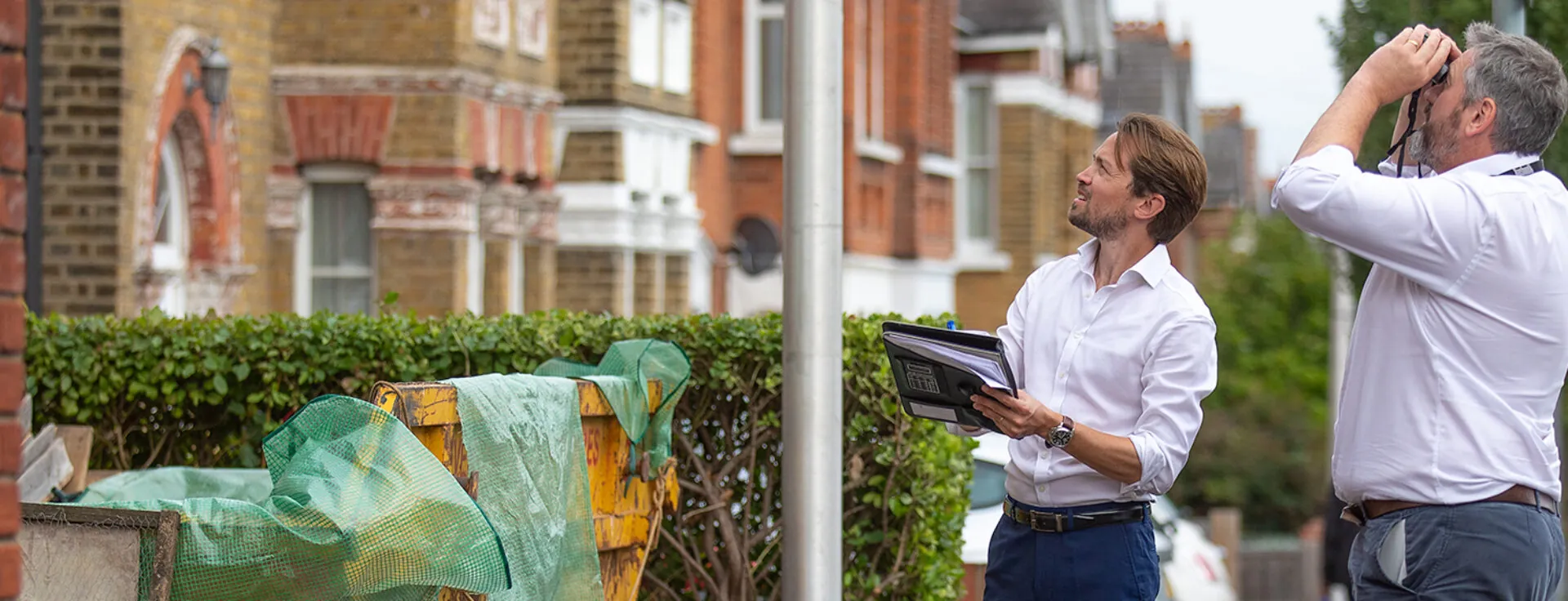 men surveying a property