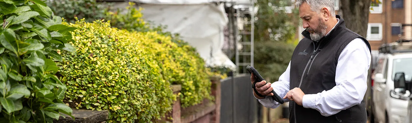 man surveying a property
